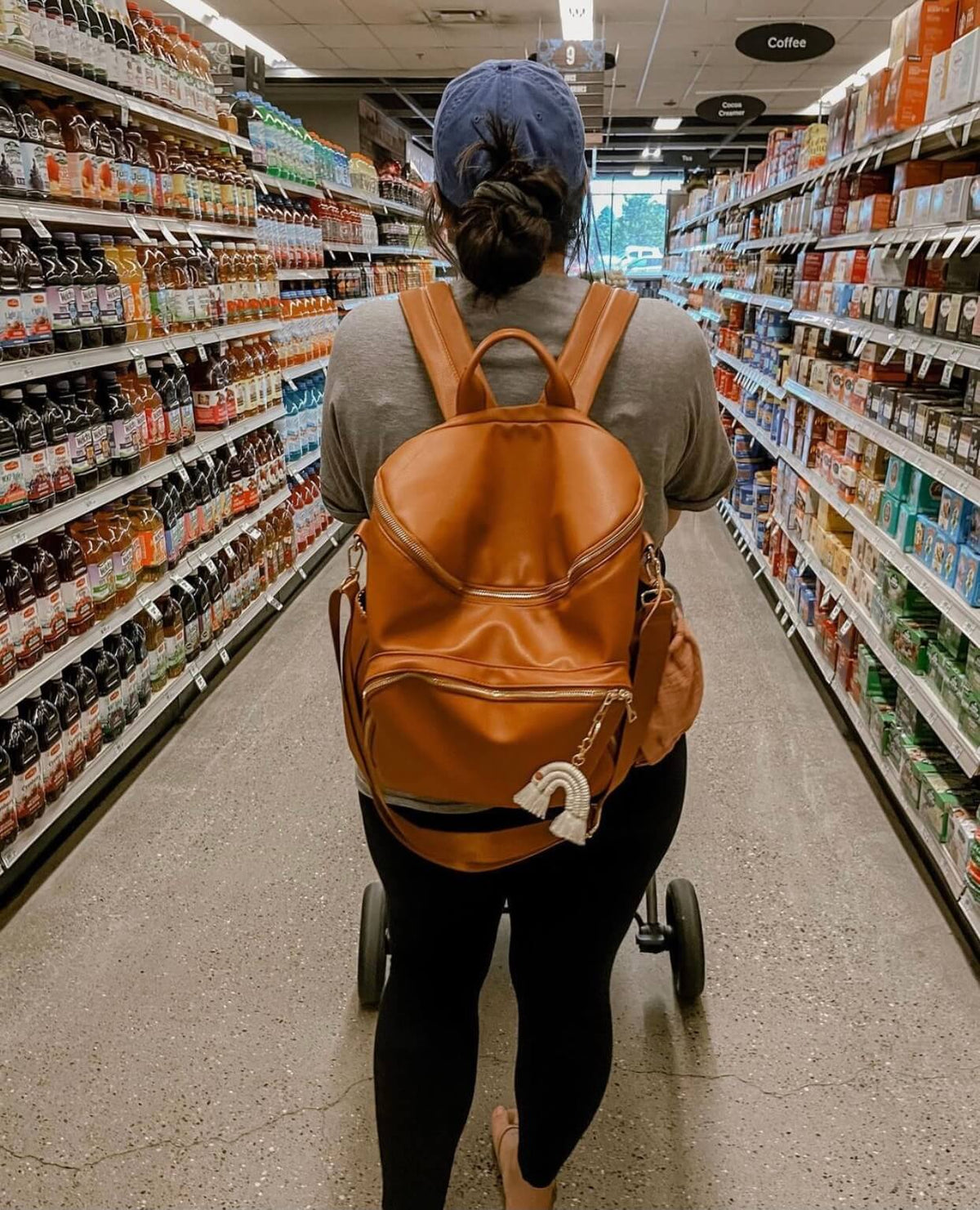 Harvey everyday backpack worn by a mom on a grocery run, back view